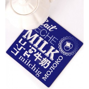 Blue and White Trivet with Text and Milk Jug by Barbara Shaw Tableware
